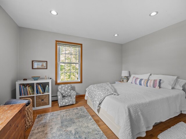 571 Pond Point Ave, Milford, CT 06460 - bedroom featuring a baseboard radiator, wood finished floors, and recessed lighting