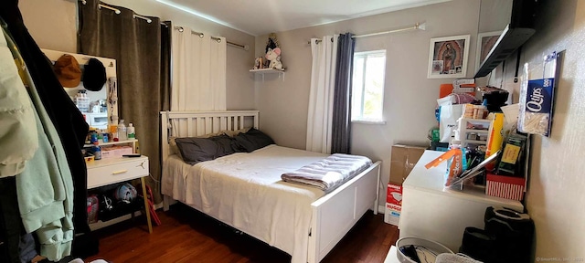 bedroom featuring dark wood-style flooring