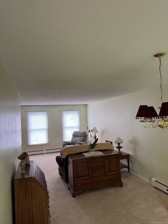bedroom featuring light colored carpet, a baseboard radiator, and a textured ceiling