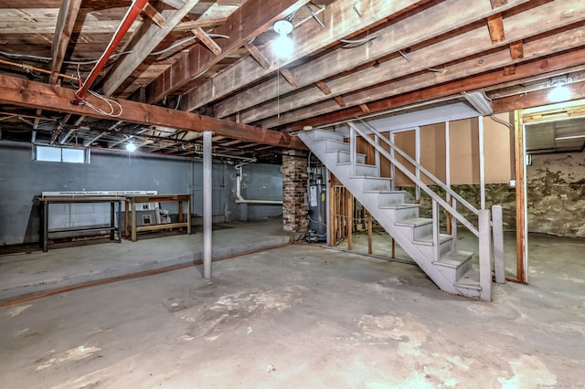 below grade area with gas water heater and stairway