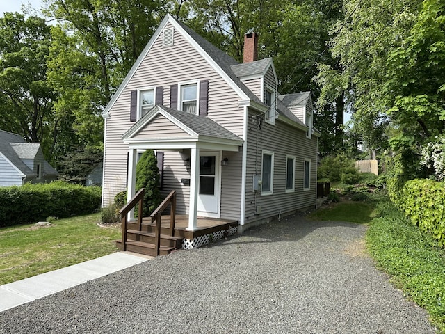 155 High St, Manchester, CT 06040 - view of front of property with a chimney, a shingled roof, a front lawn, and central AC unit