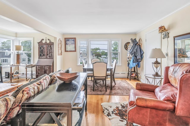 592 Courtland Ave, Bridgeport, CT 06605 - living area featuring crown molding, light wood-style flooring, and a baseboard heating unit