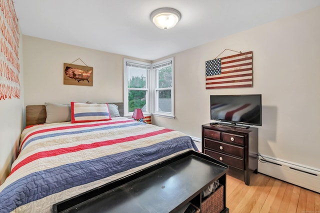 592 Courtland Ave, Bridgeport, CT 06605 - bedroom featuring light wood-style flooring, a baseboard radiator, and baseboard heating