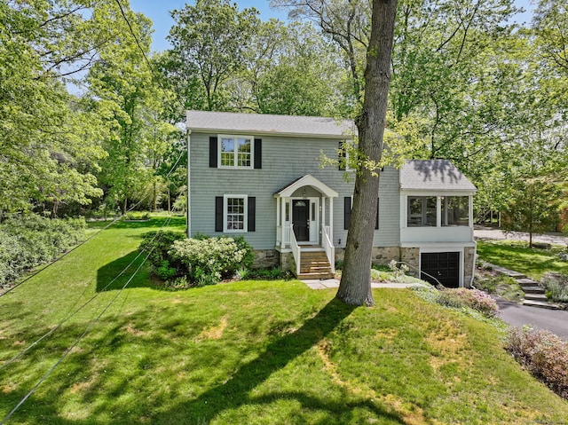 24 Richards Ln, Norwalk, CT 06851 - colonial inspired home with driveway, a garage, a front yard, and a sunroom