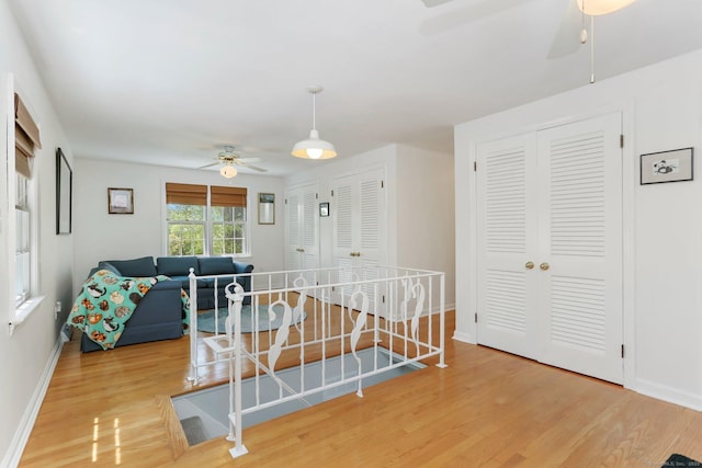 24 Richards Ln, Norwalk, CT 06851 - living area featuring a ceiling fan, wood finished floors, and baseboards