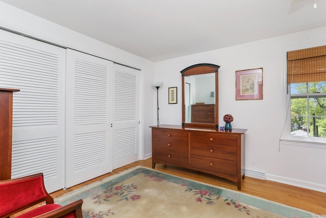 24 Richards Ln, Norwalk, CT 06851 - bedroom featuring wood finished floors, a closet, and baseboards