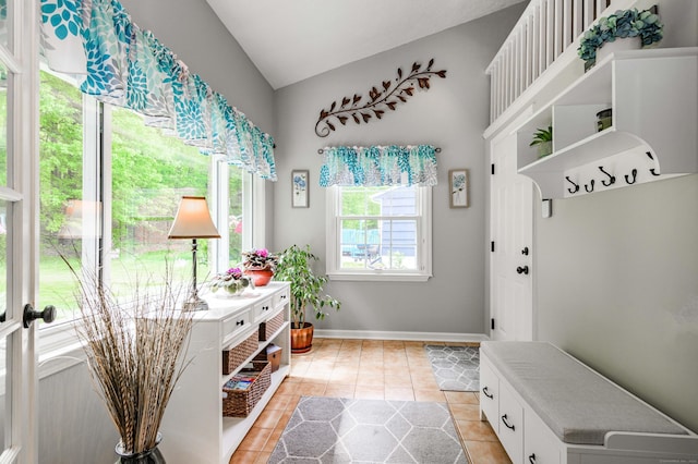 121 Dinatali Dr, Waterbury, CT 06705 - mudroom featuring lofted ceiling, light tile patterned floors, and baseboards