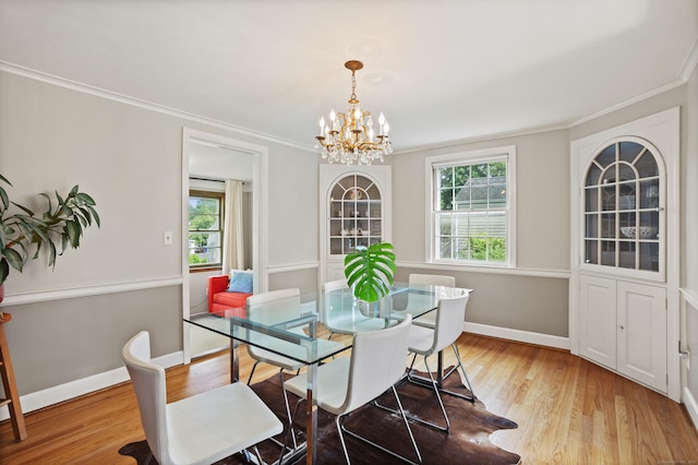 76 Glenbrook Rd, West Hartford, CT 06107 - dining room featuring a chandelier, crown molding, and light wood-style floors