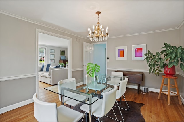 76 Glenbrook Rd, West Hartford, CT 06107 - dining space with a chandelier, wood finished floors, and crown molding