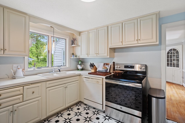 76 Glenbrook Rd, West Hartford, CT 06107 - kitchen featuring white dishwasher, stainless steel range with electric cooktop, cream cabinets, and light countertops