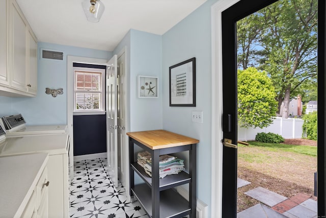 76 Glenbrook Rd, West Hartford, CT 06107 - laundry room featuring cabinet space, washing machine and dryer, and light flooring