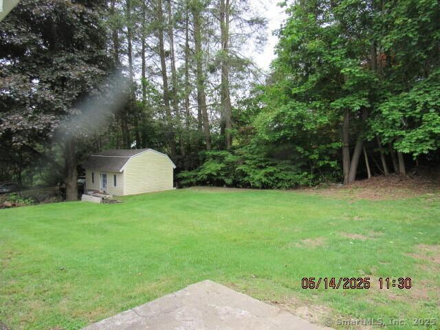 8 Noble Ave, Naugatuck, CT 06770 - view of grassy yard with an outbuilding and a storage unit