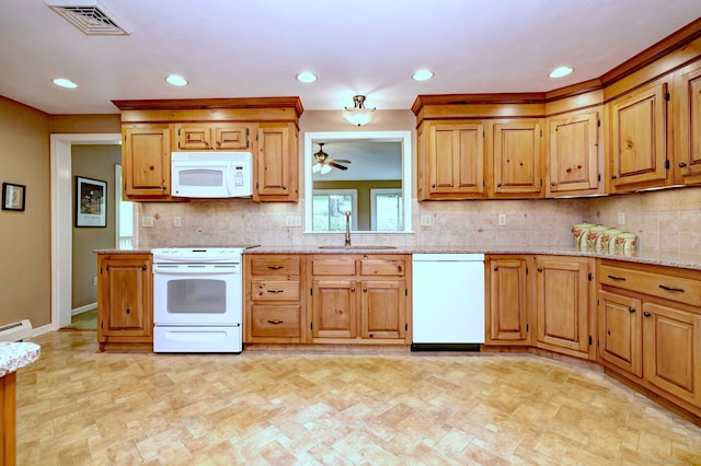 980 Mount Carmel Ave, Hamden, CT 06518 - kitchen featuring white appliances, a sink, recessed lighting, decorative backsplash, and light stone counters