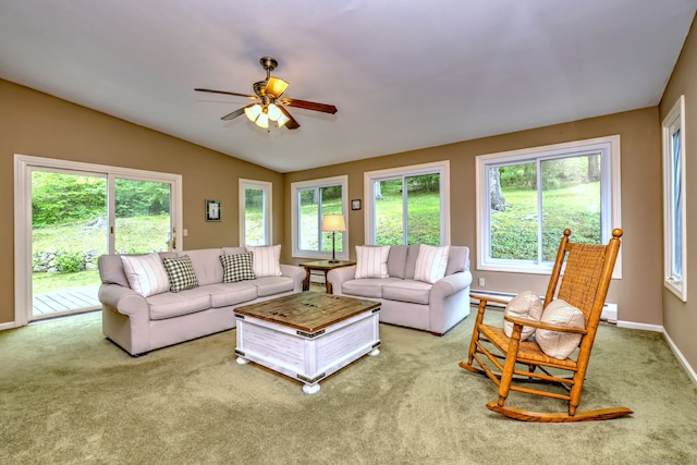 980 Mount Carmel Ave, Hamden, CT 06518 - living area with plenty of natural light, carpet, a ceiling fan, vaulted ceiling, and a baseboard radiator