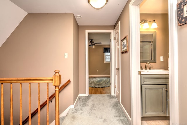 980 Mount Carmel Ave, Hamden, CT 06518 - corridor with a sink, an upstairs landing, baseboards, and carpet