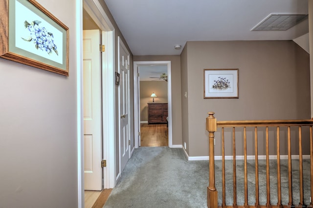 980 Mount Carmel Ave, Hamden, CT 06518 - hall with light carpet, an upstairs landing, and baseboards