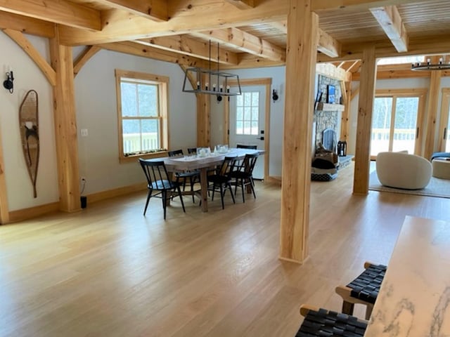 24 Calhoun St, Washington, CT 06794 - dining area with plenty of natural light, beam ceiling, a chandelier, and light wood-style flooring