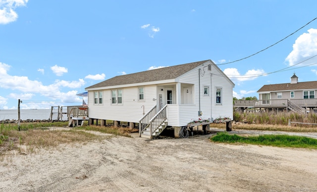 27 Barnes Rd, Old Saybrook, CT 06475 - view of front facade featuring a shingled roof