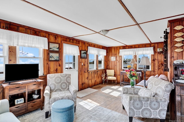 27 Barnes Rd, Old Saybrook, CT 06475 - living area with plenty of natural light, wood walls, and hardwood / wood-style flooring