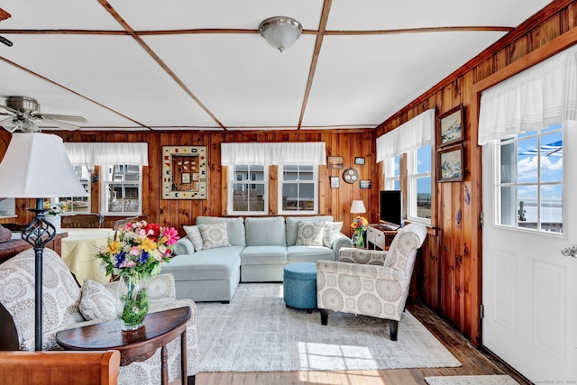 27 Barnes Rd, Old Saybrook, CT 06475 - living area featuring wood finished floors, wooden walls, and ceiling fan