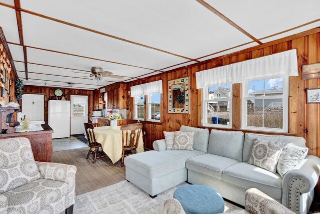 27 Barnes Rd, Old Saybrook, CT 06475 - living area featuring wood walls, ceiling fan, and wood finished floors