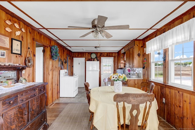 27 Barnes Rd, Old Saybrook, CT 06475 - dining room with wood walls, a ceiling fan, and wood finished floors