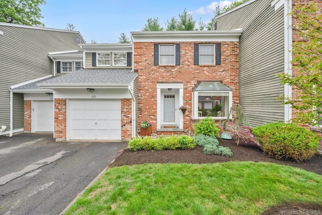 112 Tunxis Vlg Unit 112, Farmington, CT 06032 - multi unit property featuring brick siding, driveway, and a shingled roof