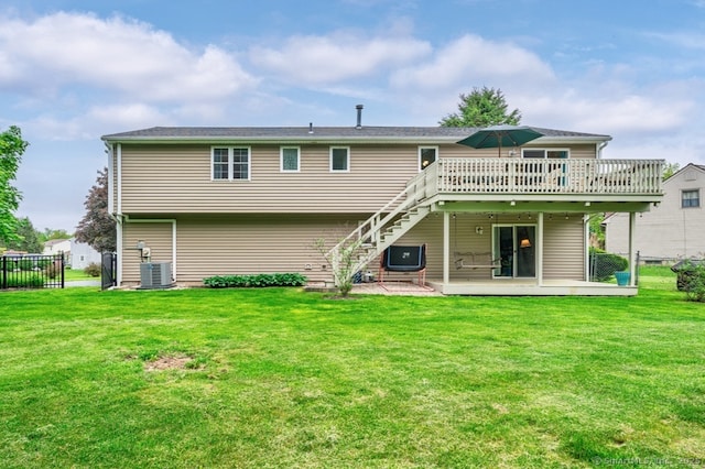 back of property with a wooden deck, stairway, and central air condition unit