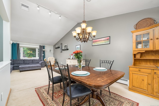 dining space featuring a baseboard radiator, light carpet, a chandelier, rail lighting, and lofted ceiling