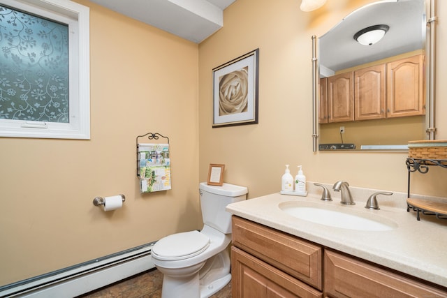 bathroom with a baseboard radiator, toilet, and vanity