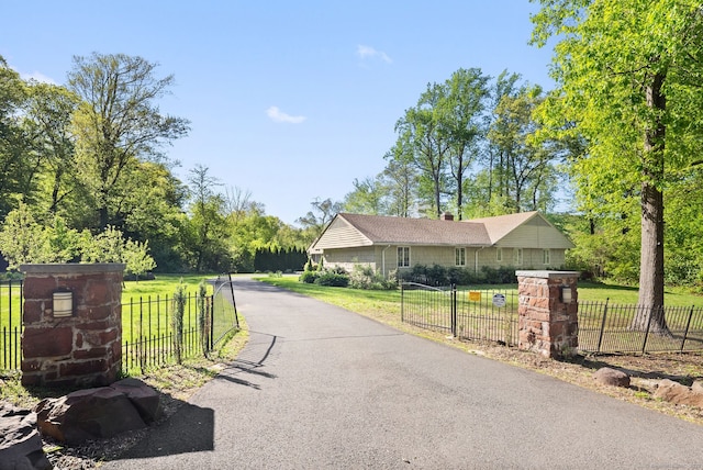 1 Penwood Rd, Bloomfield, CT 06002 - view of asphalt driveway with a gated entry