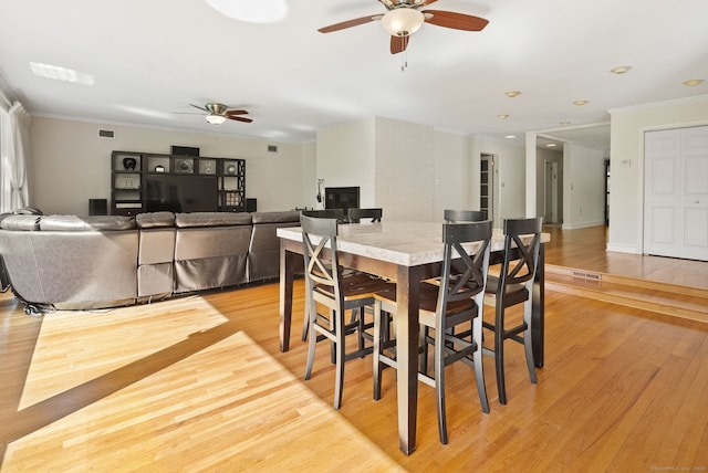 1 Penwood Rd, Bloomfield, CT 06002 - dining area featuring ceiling fan, light wood-type flooring, and ornamental molding