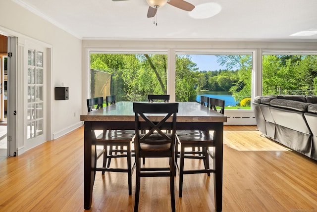 1 Penwood Rd, Bloomfield, CT 06002 - sunroom with baseboard heating, view of wooded area, and a water view
