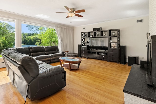 1 Penwood Rd, Bloomfield, CT 06002 - living area featuring a ceiling fan, plenty of natural light, ornamental molding, and light wood-style flooring