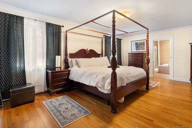 1 Penwood Rd, Bloomfield, CT 06002 - bedroom with ornamental molding, wood finished floors, and ensuite bath