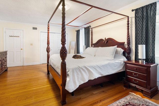 1 Penwood Rd, Bloomfield, CT 06002 - bedroom with crown molding, light wood-type flooring, and baseboards