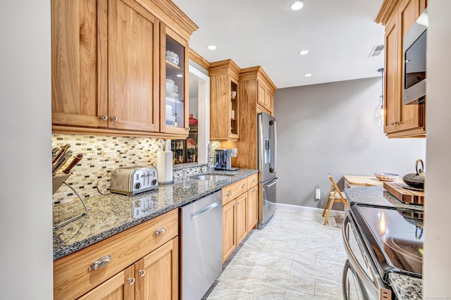 123 Old Belden Hill Rd Apt 41, Norwalk, CT 06850 - kitchen featuring appliances with stainless steel finishes, backsplash, a sink, recessed lighting, and glass insert cabinets