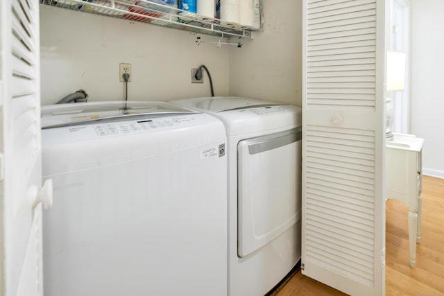 123 Old Belden Hill Rd Apt 41, Norwalk, CT 06850 - washroom featuring washing machine and dryer and light wood finished floors