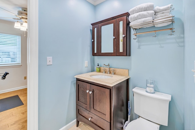 123 Old Belden Hill Rd Apt 41, Norwalk, CT 06850 - bathroom featuring ornamental molding, wood finished floors, ceiling fan, baseboards, and vanity