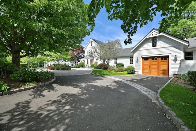 144 S Ave, New Canaan, CT 06840 - view of front of home with asphalt driveway and an attached garage