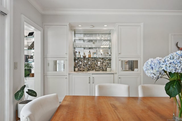 144 S Ave, New Canaan, CT 06840 - indoor wet bar with crown molding, backsplash, and recessed lighting