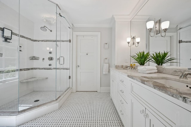 144 S Ave, New Canaan, CT 06840 - bathroom with a shower stall, double vanity, baseboards, and a chandelier