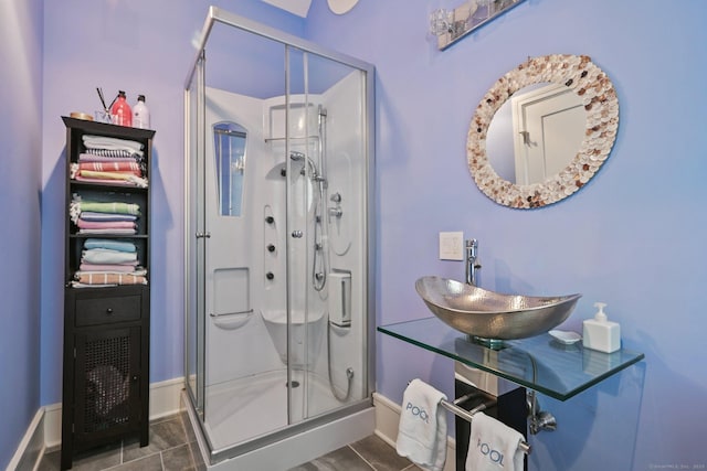 144 S Ave, New Canaan, CT 06840 - bathroom with a sink, a stall shower, and baseboards