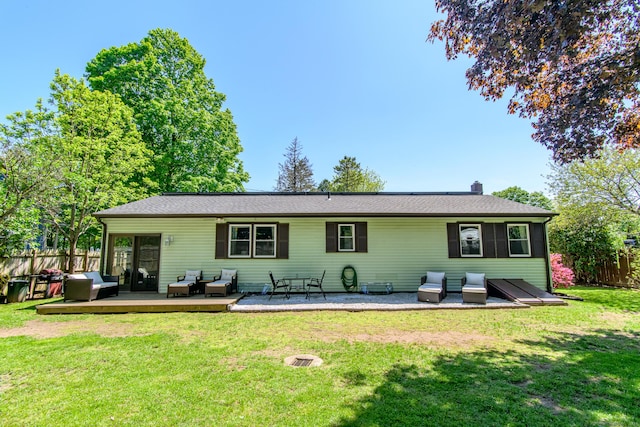 rear view of property featuring outdoor lounge area and a chimney