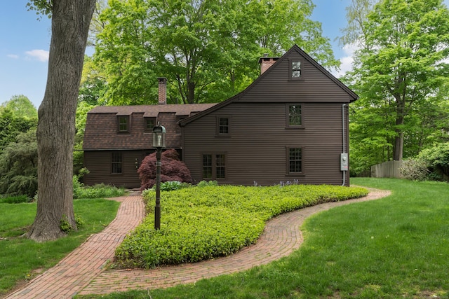 804 Forest Rd, North Branford, CT 06472 - back of property with a chimney, a lawn, and a shingled roof