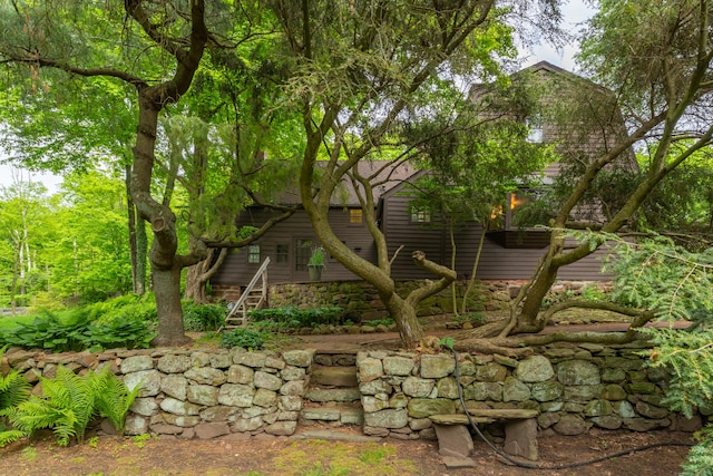 804 Forest Rd, North Branford, CT 06472 - view of home's exterior with stairway and stone siding