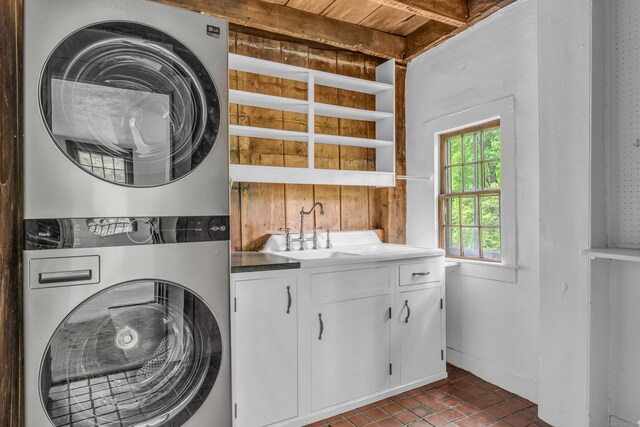 804 Forest Rd, North Branford, CT 06472 - washroom with stacked washer / dryer, cabinet space, tile patterned flooring, and wood ceiling