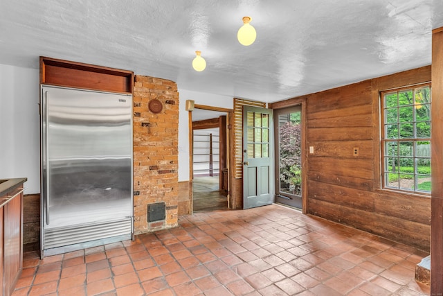 804 Forest Rd, North Branford, CT 06472 - kitchen with built in fridge and wood walls