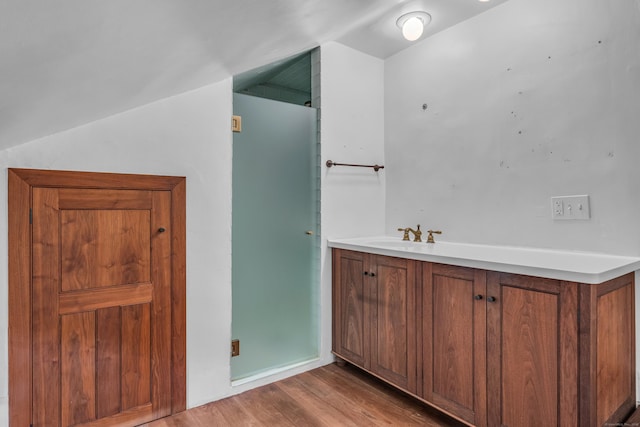 804 Forest Rd, North Branford, CT 06472 - bathroom with wood finished floors, vaulted ceiling, and a sink