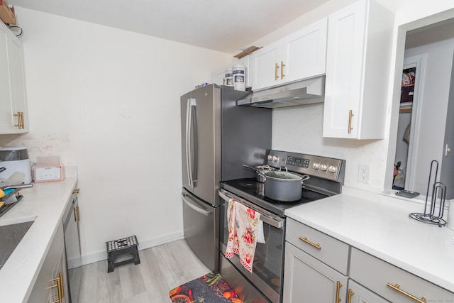 kitchen featuring stainless steel range with electric cooktop, under cabinet range hood, light wood-style flooring, light countertops, and white cabinetry